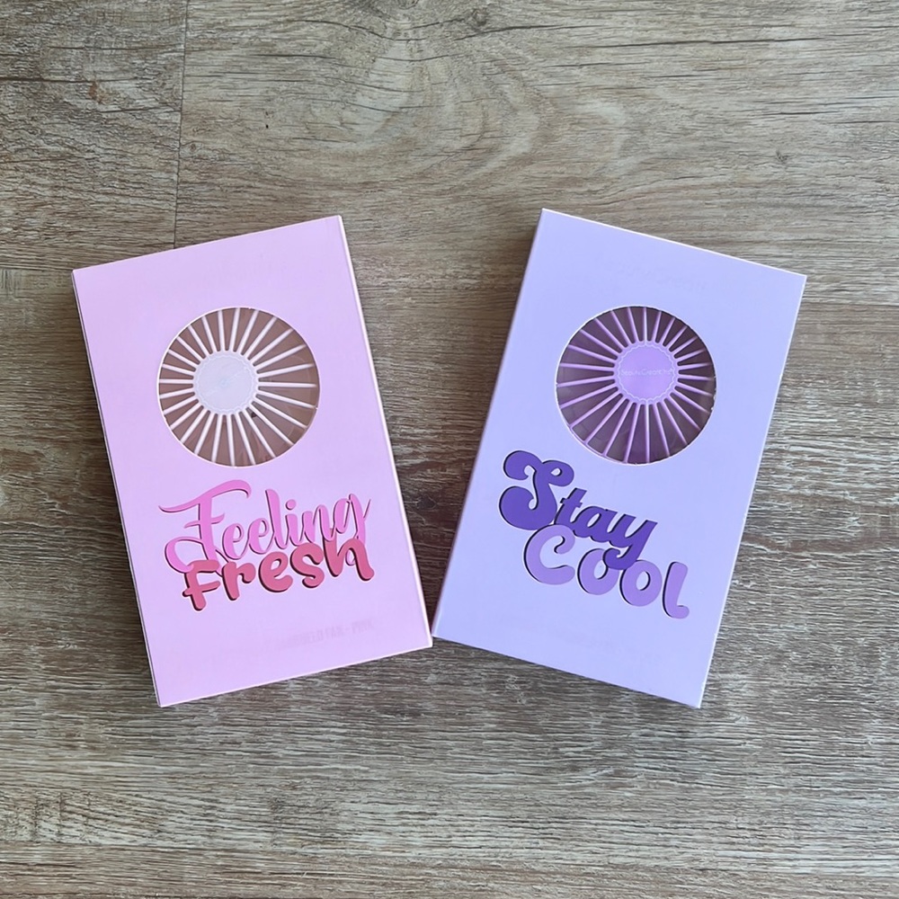 Face fan, rechargeable, USB cable charger included. Pink and purple available